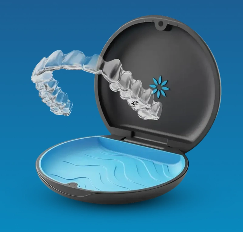 Orthodontic retainer case with clear retainer and blue gel insert on bright blue background.